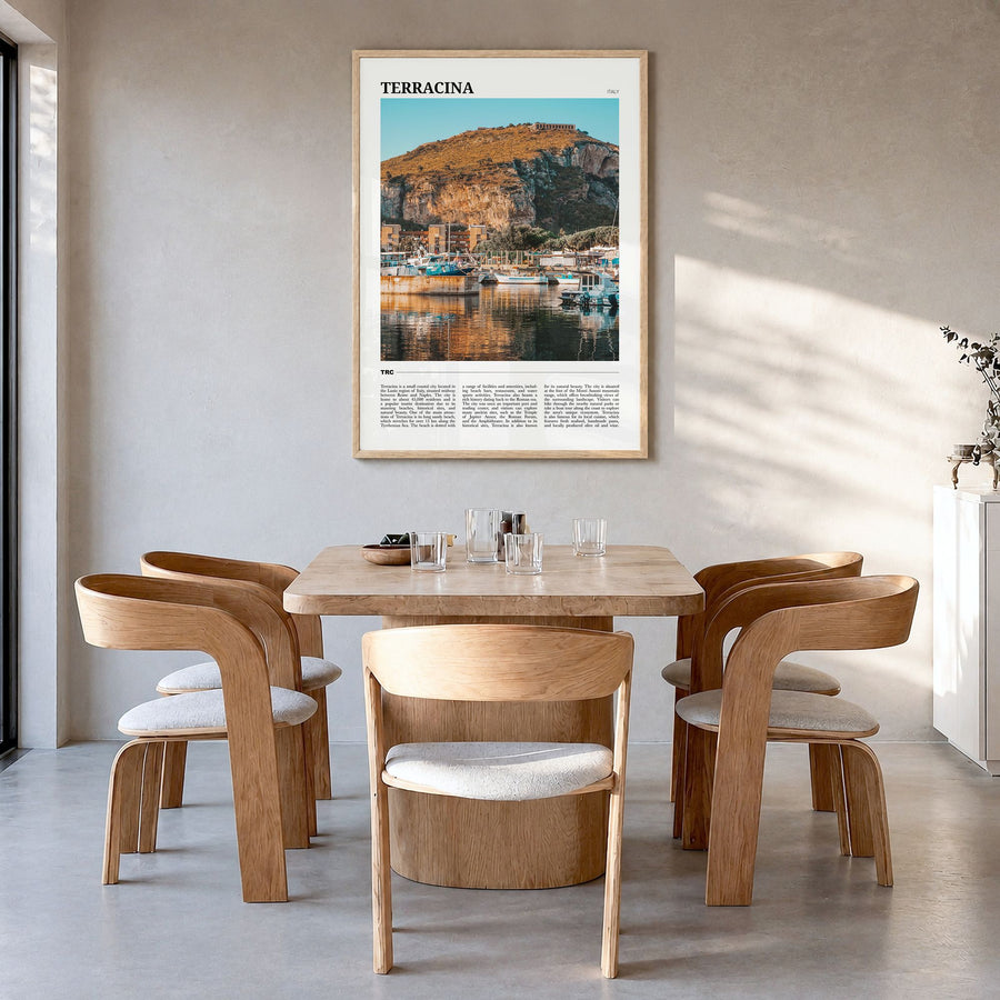 Terracina Travel Poster in a natural wood frame, hanging in a dining room
