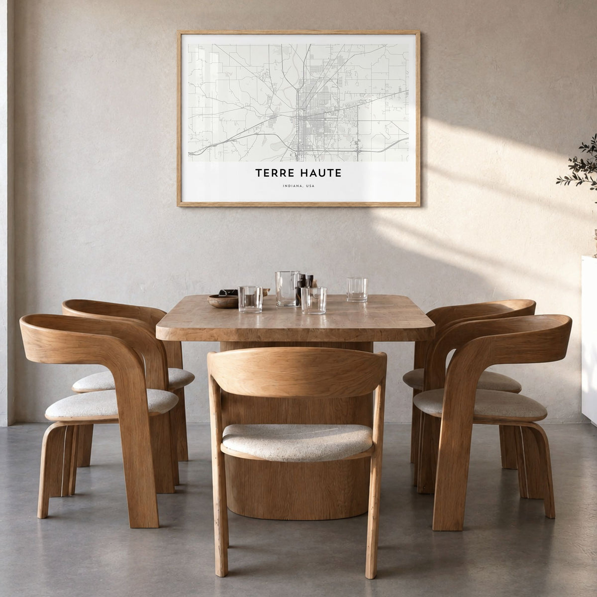 Terre Haute Map Poster in a natural wood frame, hanging in a dining room