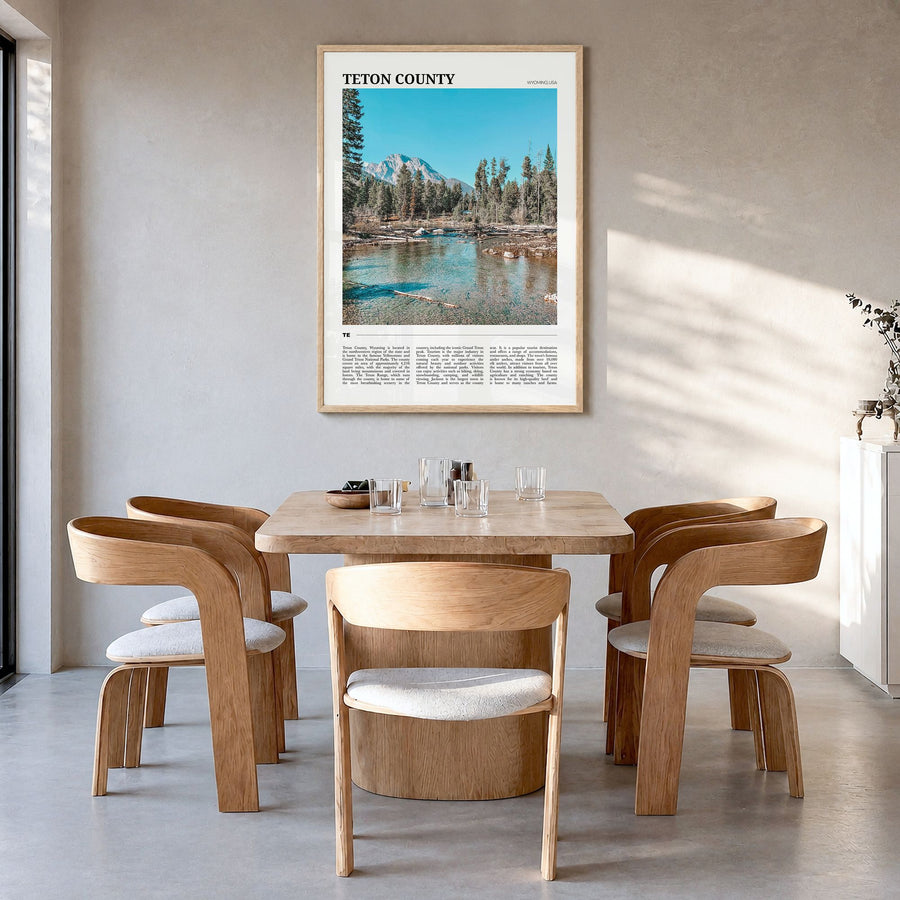 Teton County Travel Poster in a natural wood frame, hanging in a dining room