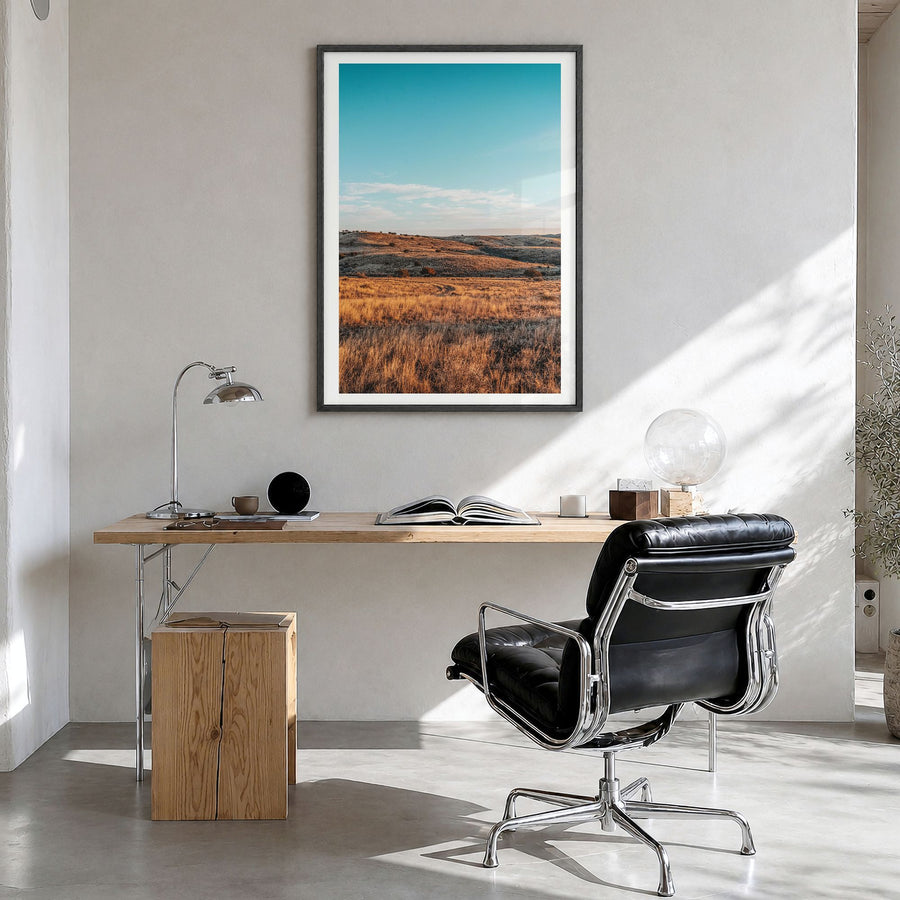 Texas Photo Poster in a black wood frame, hanging in a bright home office, white border