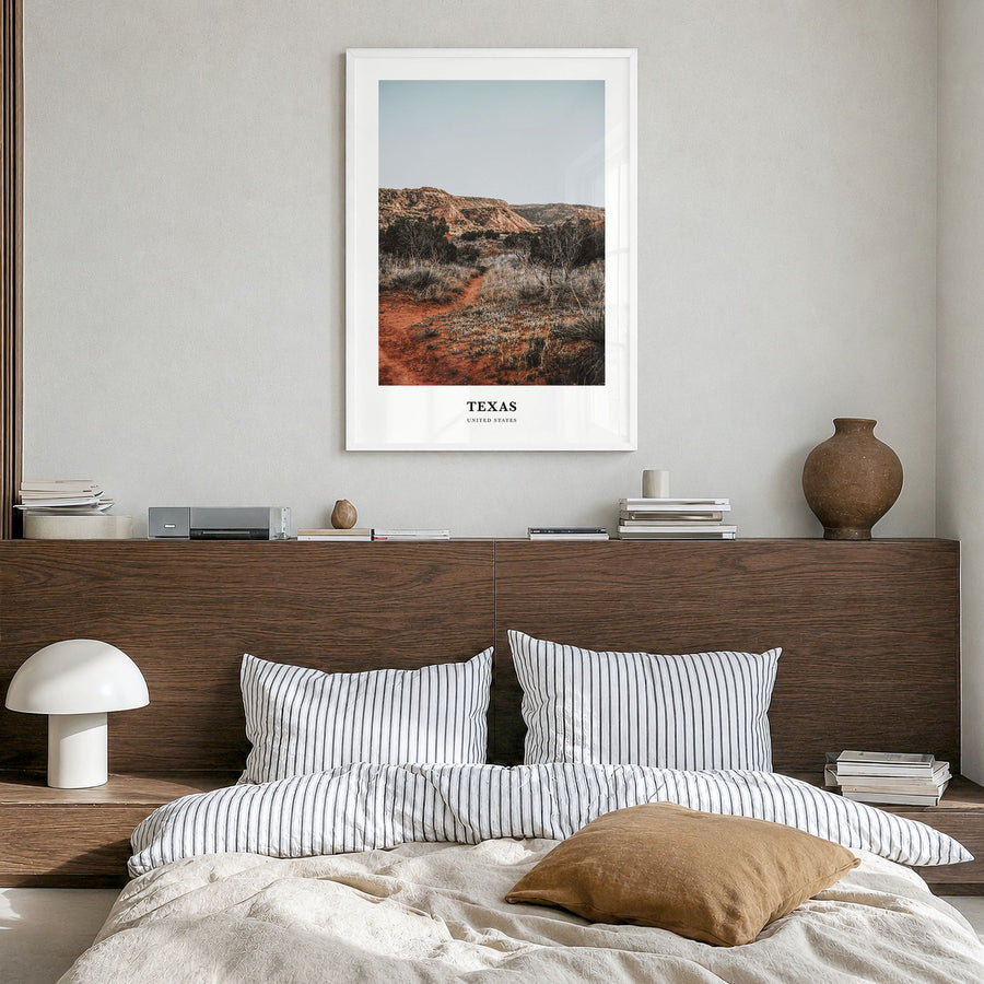 Texas Classic No 1 Poster in a white wood frame, hanging in a bedroom