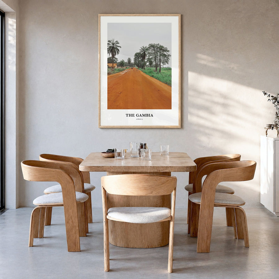 The Gambia Classic Poster in a natural wood frame, hanging in a dining room