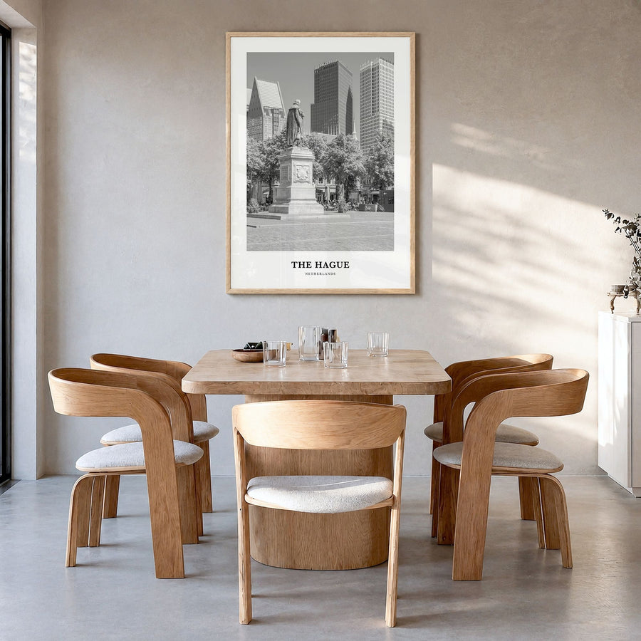 The Hague Classic Poster in a natural wood frame, hanging in a dining room