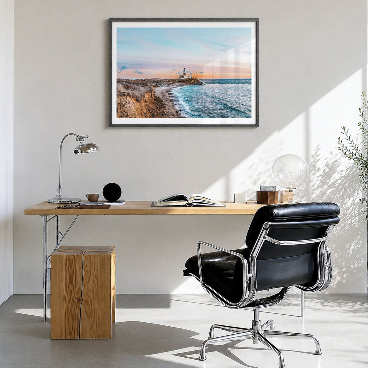 The Hamptons Photo Poster in a black wood frame, hanging in a bright home office, white border
