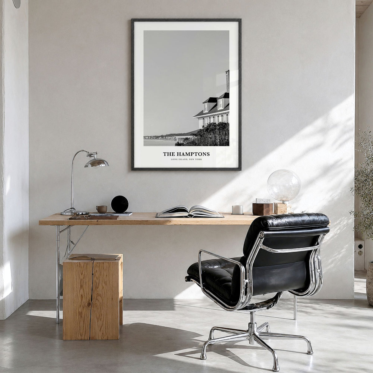 The Hamptons Classic Poster in a black wood frame, hanging in a bright home office