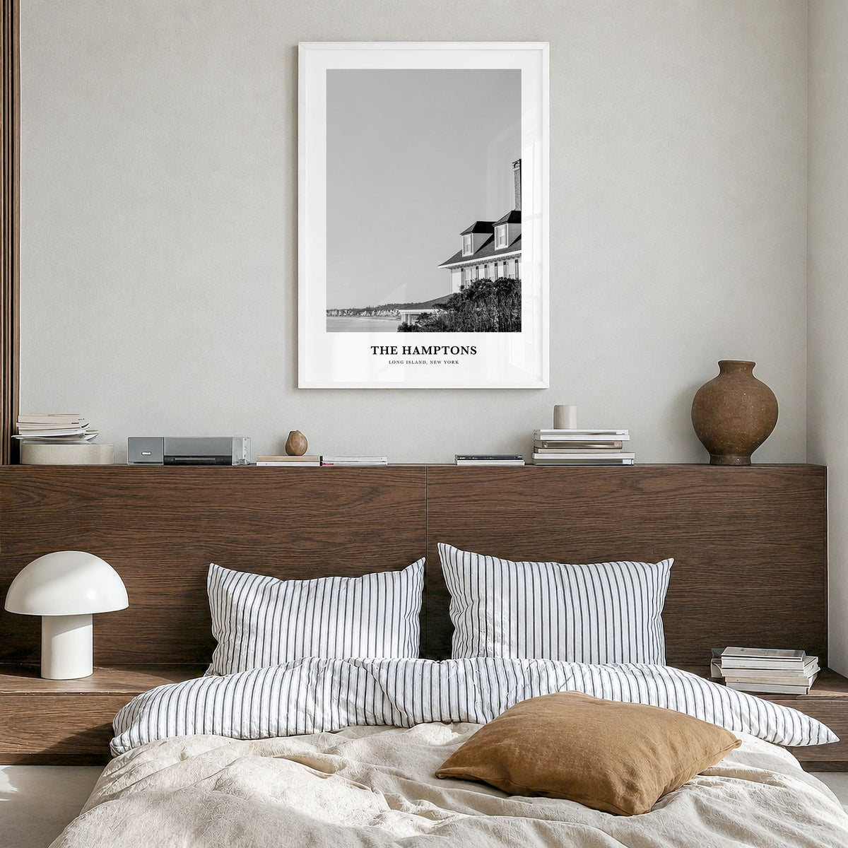 The Hamptons Classic Poster in a white wood frame, hanging in a bedroom