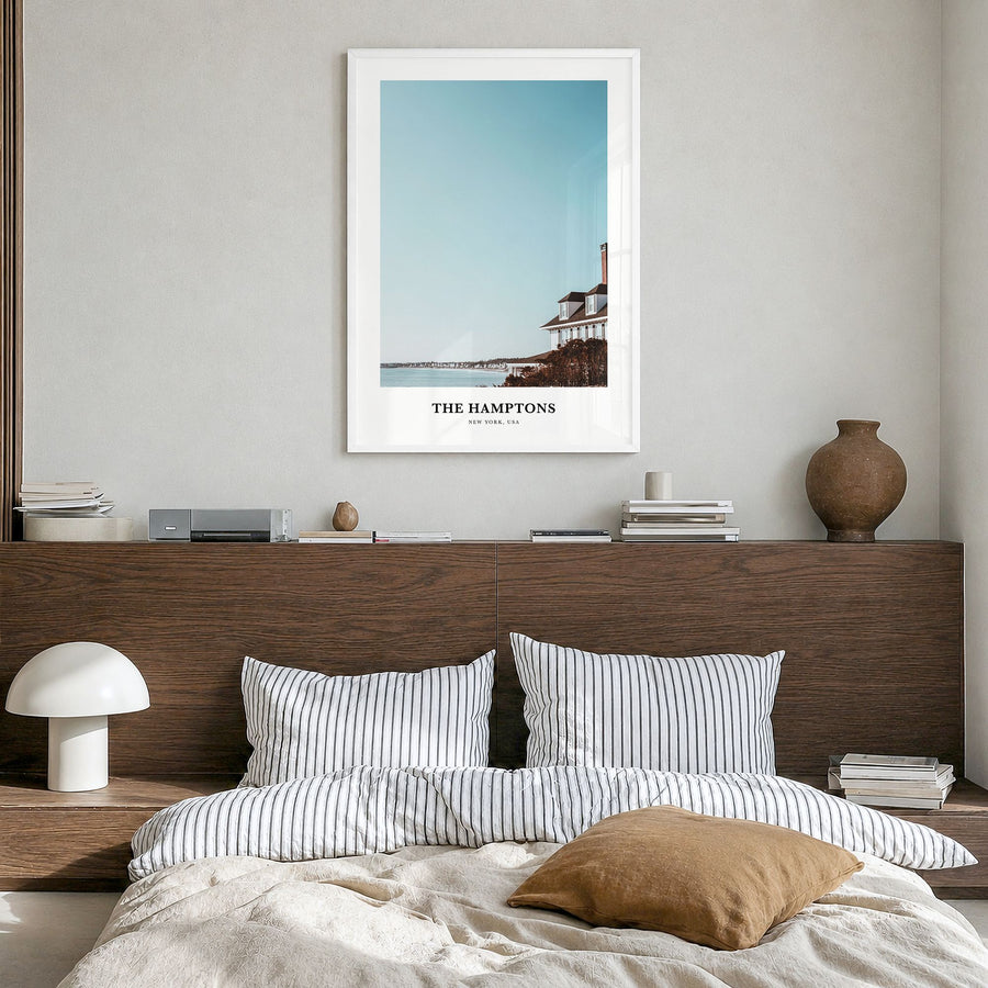 The Hamptons Classic Poster in a white wood frame, hanging in a bedroom