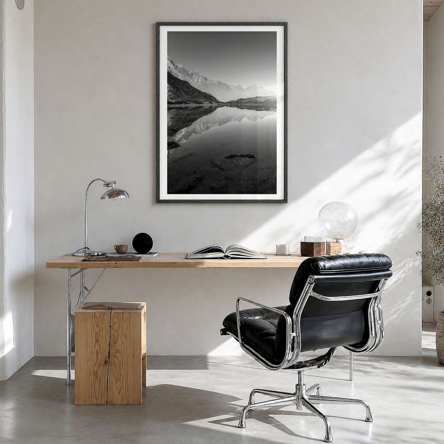 The Himalayas Photo Poster in a black wood frame, hanging in a bright home office, white border