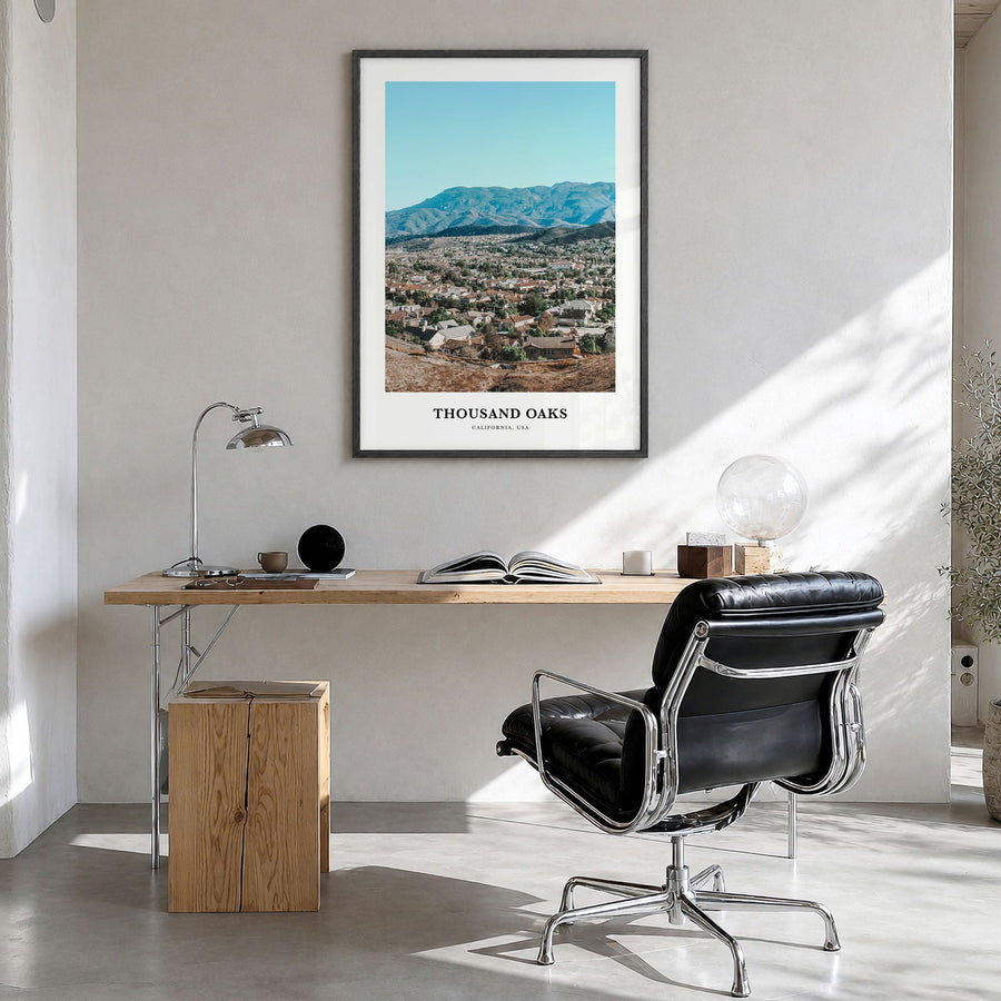 Thousand Oaks Classic Poster in a black wood frame, hanging in a bright home office