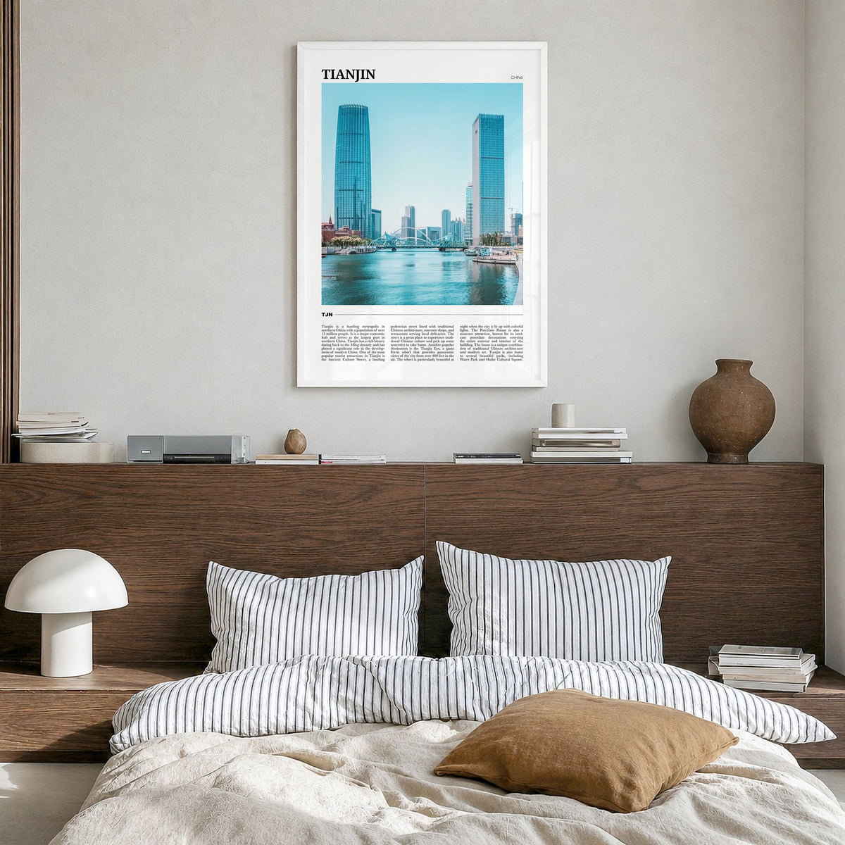 Tianjin Travel Poster in a white wood frame, hanging in a bedroom