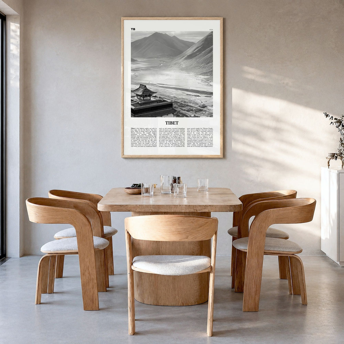 Tibet Newspaper Poster in a natural wood frame, hanging in a dining room