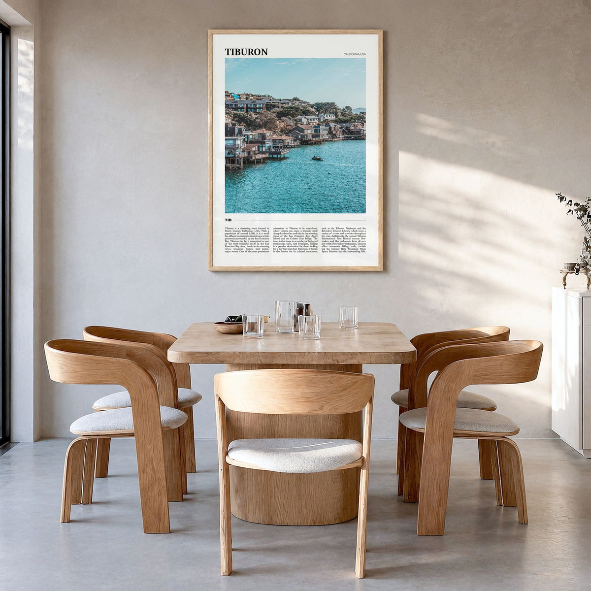 Tiburon Travel Poster in a natural wood frame, hanging in a dining room