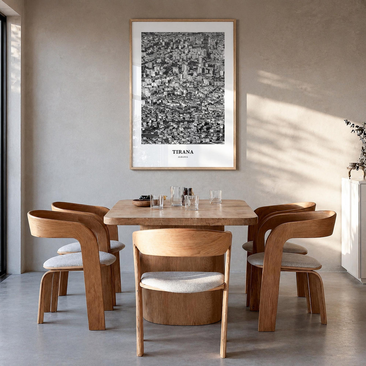 Tirana black & white classic poster of Albania – vertical wall art in natural wood frame, hanging on wall
