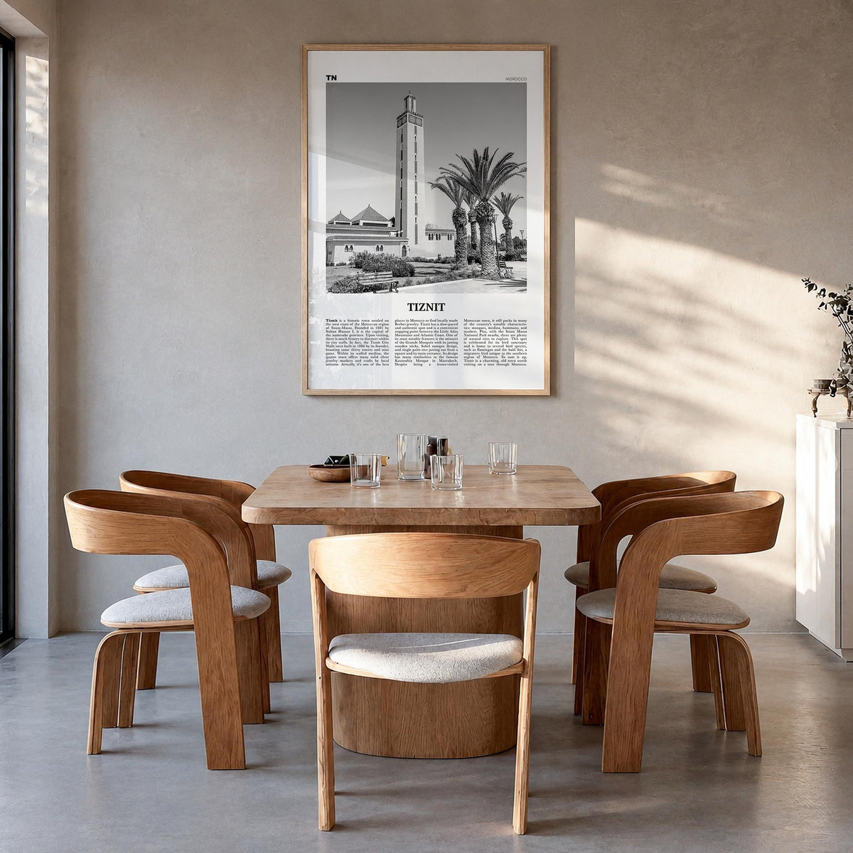 Tiznit black & white newspaper poster of Morocco – vertical wall art in natural wood frame, hanging on wall