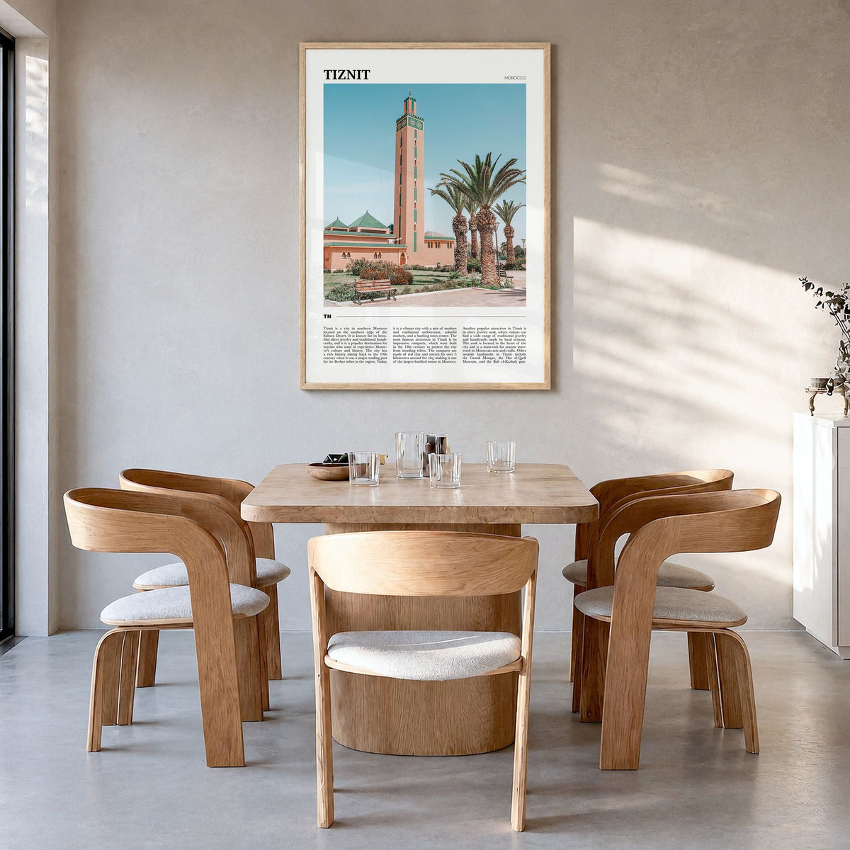 Tiznit Travel Poster in a natural wood frame, hanging in a dining room