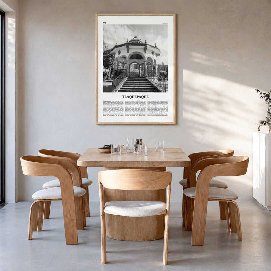 Tlaquepaque Newspaper Poster in a natural wood frame, hanging in a dining room