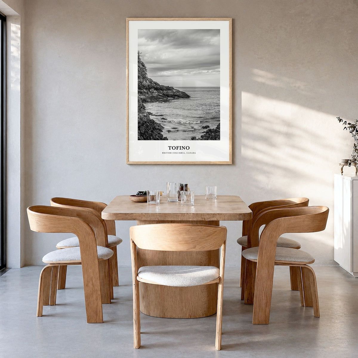 Tofino Classic Poster in a natural wood frame, hanging in a dining room