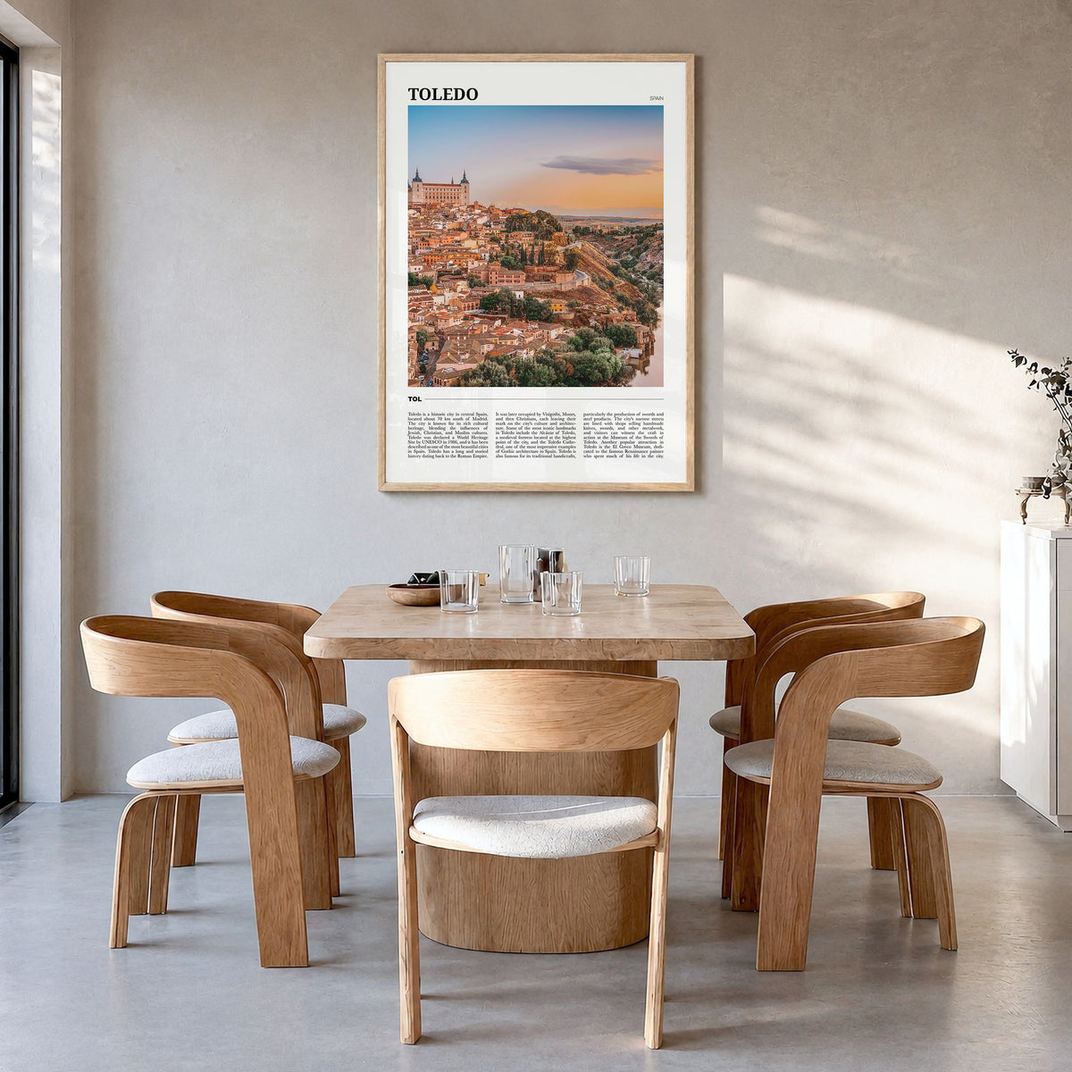 Toledo, Spain Travel Poster in a natural wood frame, hanging in a dining room