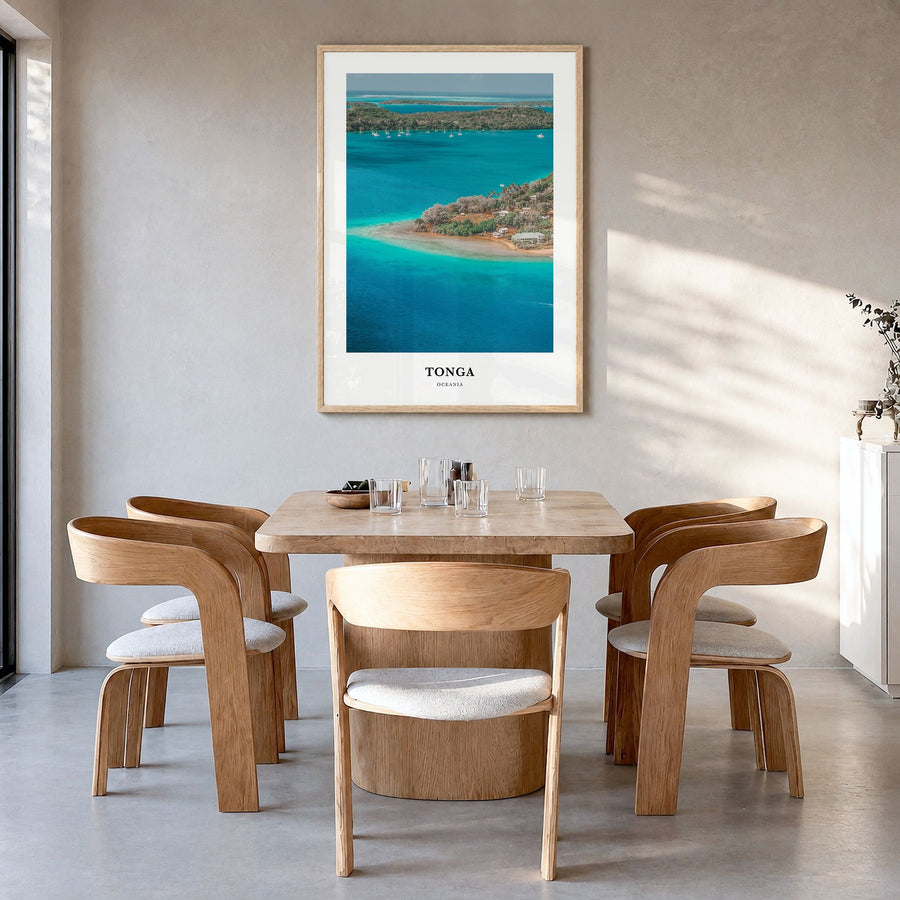 Tonga Classic Poster in a natural wood frame, hanging in a dining room