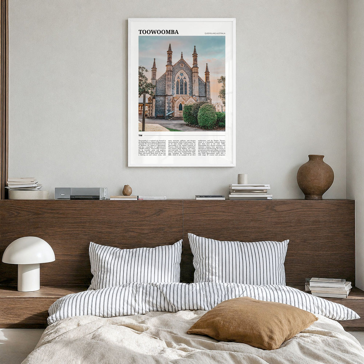 Toowoomba Travel Poster in a white wood frame, hanging in a bedroom