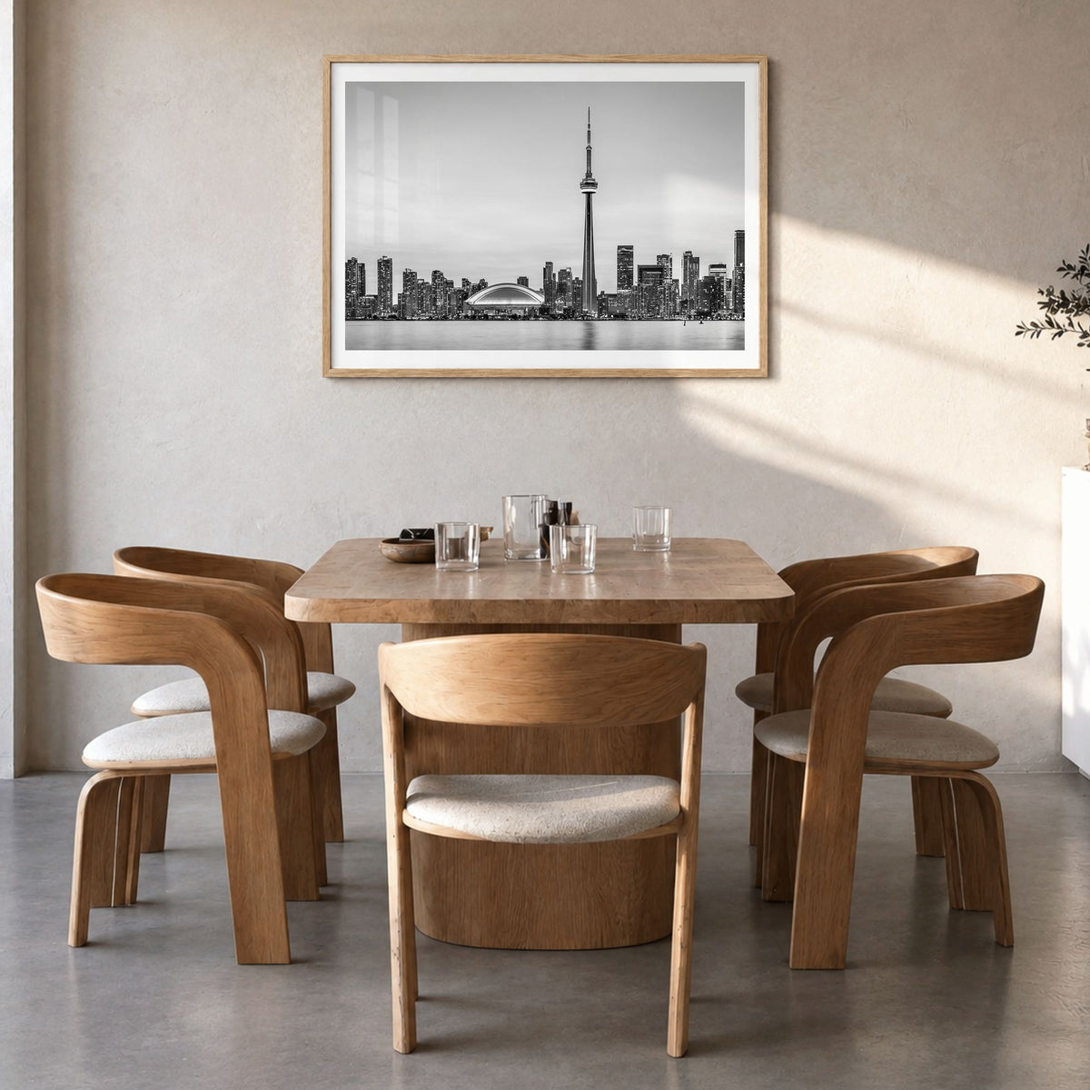 Toronto Photo Poster in a natural wood frame, hanging in a dining room, white border