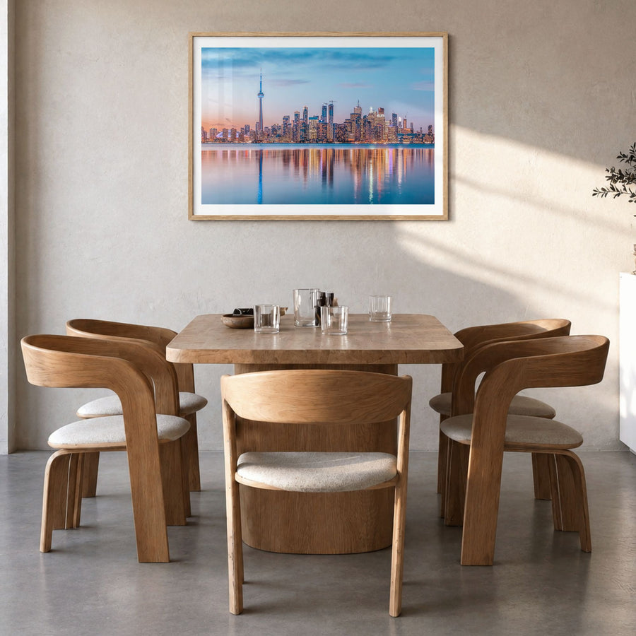 Toronto Photo Poster in a natural wood frame, hanging in a dining room, white border