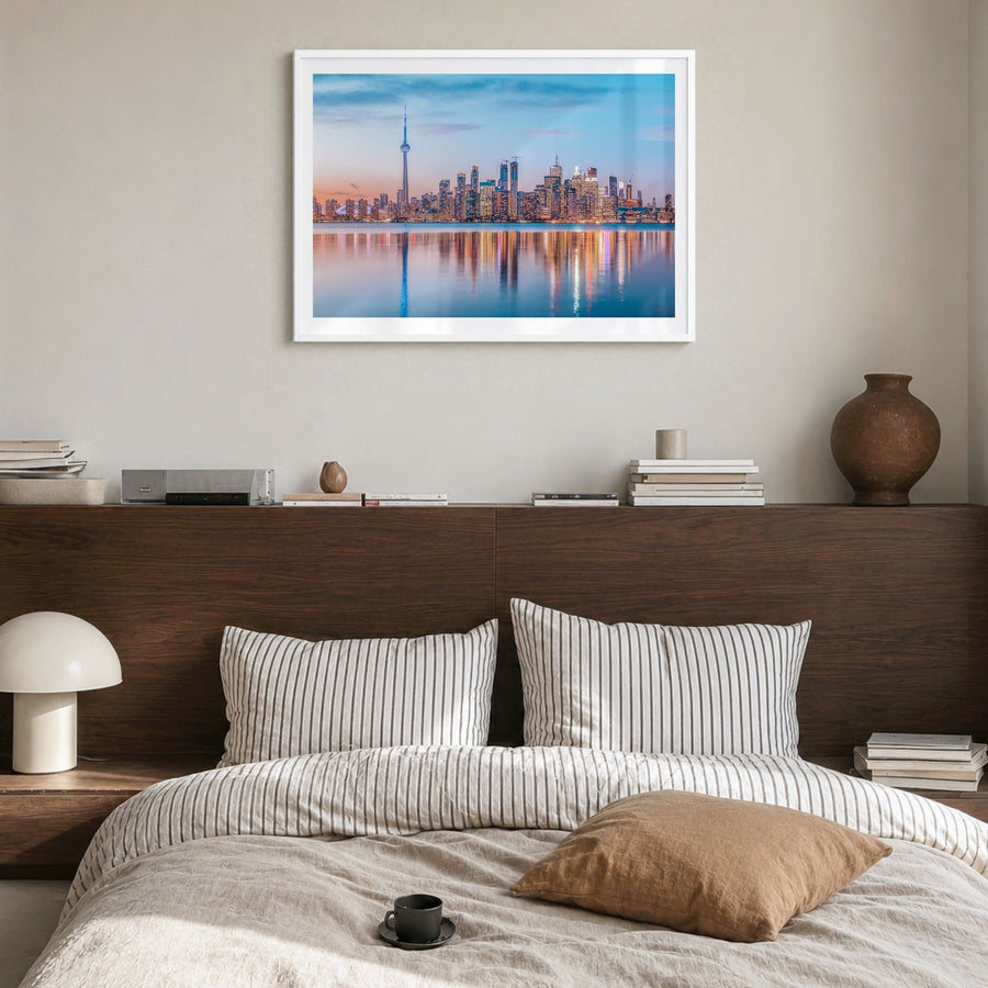 Toronto Photo Poster in a white wood frame, hanging in a bedroom, white border