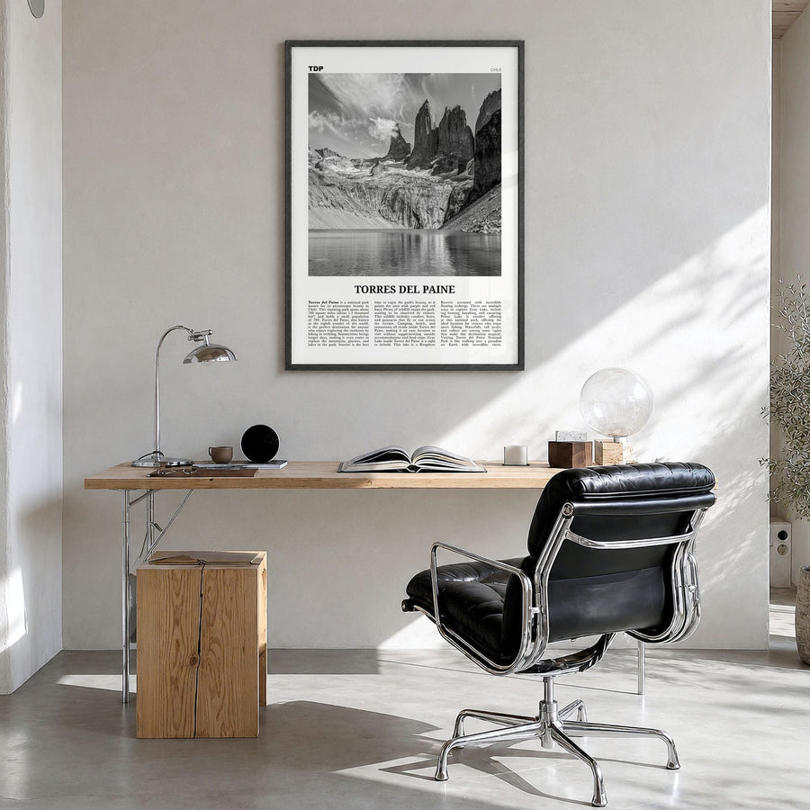 Torres del Paine Newspaper Poster in a black wood frame, hanging in a bright home office