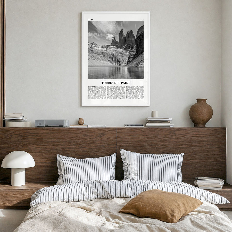 Torres del Paine Newspaper Poster in a white wood frame, hanging in a bedroom