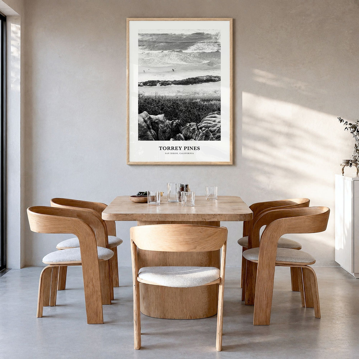 Torrey Pines Classic No 1 Poster in a natural wood frame, hanging in a dining room