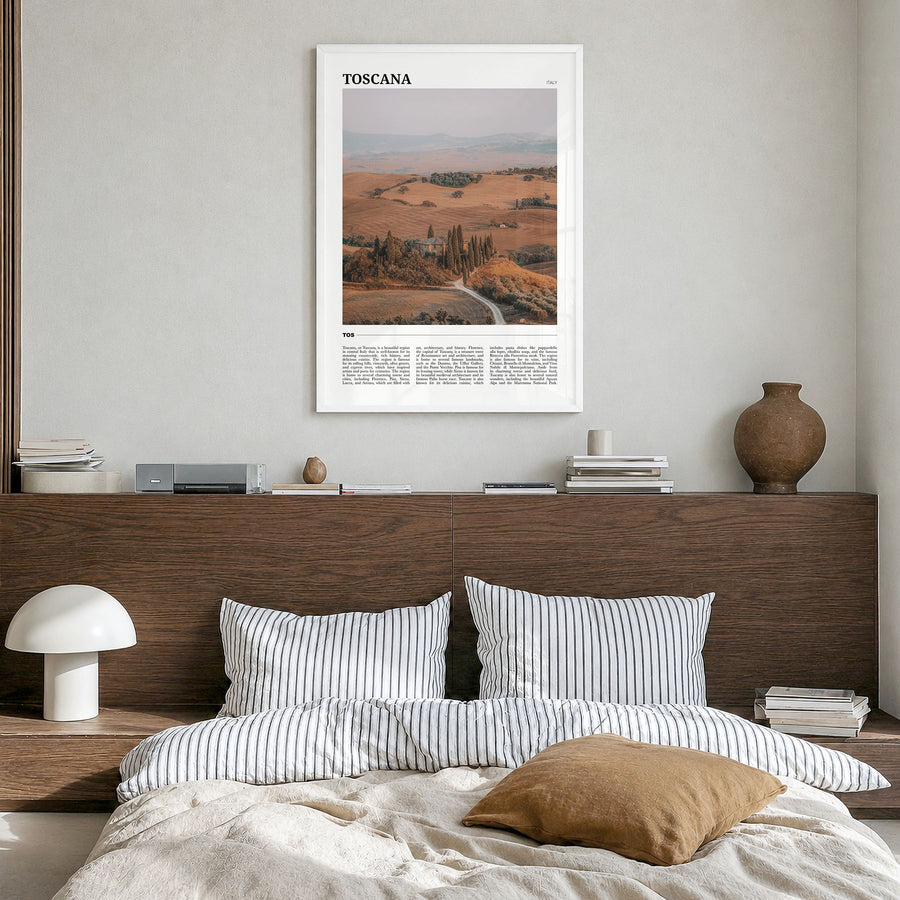 Toscana Travel Poster in a white wood frame, hanging in a bedroom