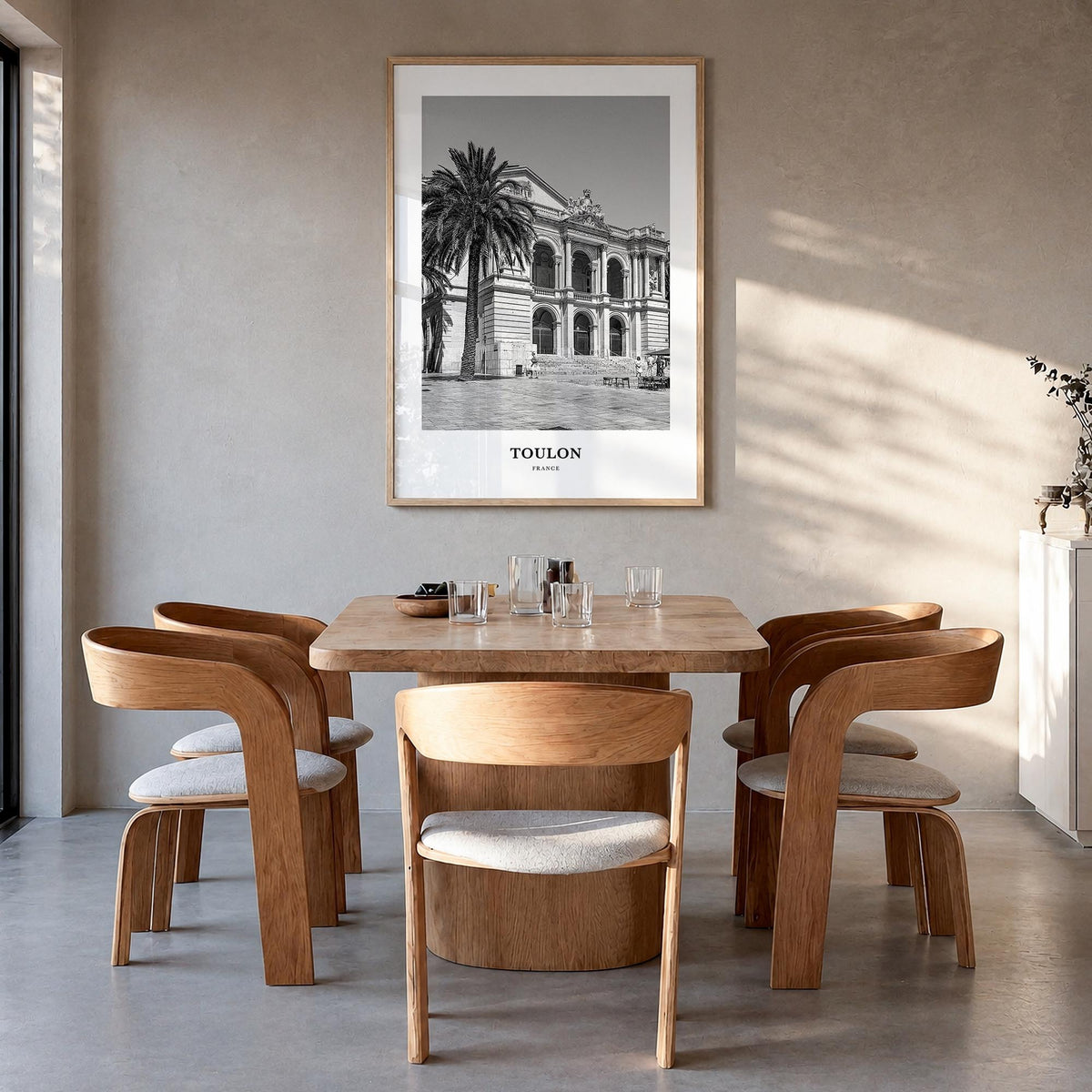 Toulon black & white classic poster of France – vertical wall art in natural wood frame, hanging on wall