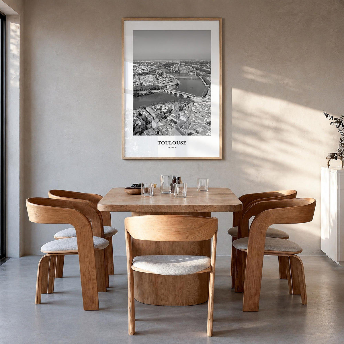 Toulouse black & white classic poster of France – vertical wall art in natural wood frame, hanging on wall