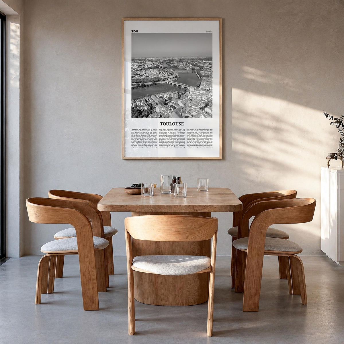 Toulouse black & white newspaper poster of France – vertical wall art in natural wood frame, hanging on wall