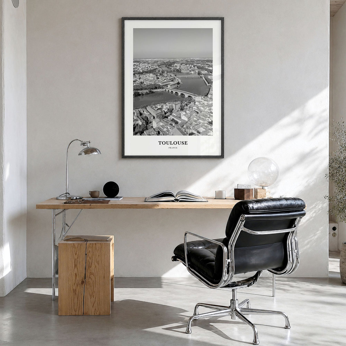 Toulouse Classic Poster in a black wood frame, hanging in a bright home office