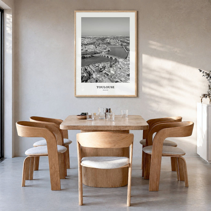 Toulouse Classic Poster in a natural wood frame, hanging in a dining room