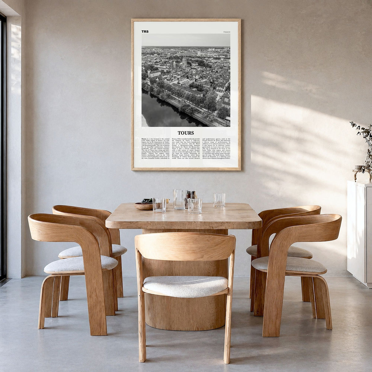 Tours Newspaper Poster in a natural wood frame, hanging in a dining room