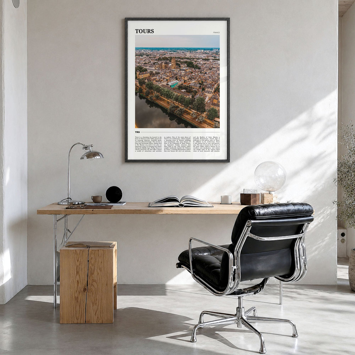 Tours Travel Poster in a black wood frame, hanging in a bright home office