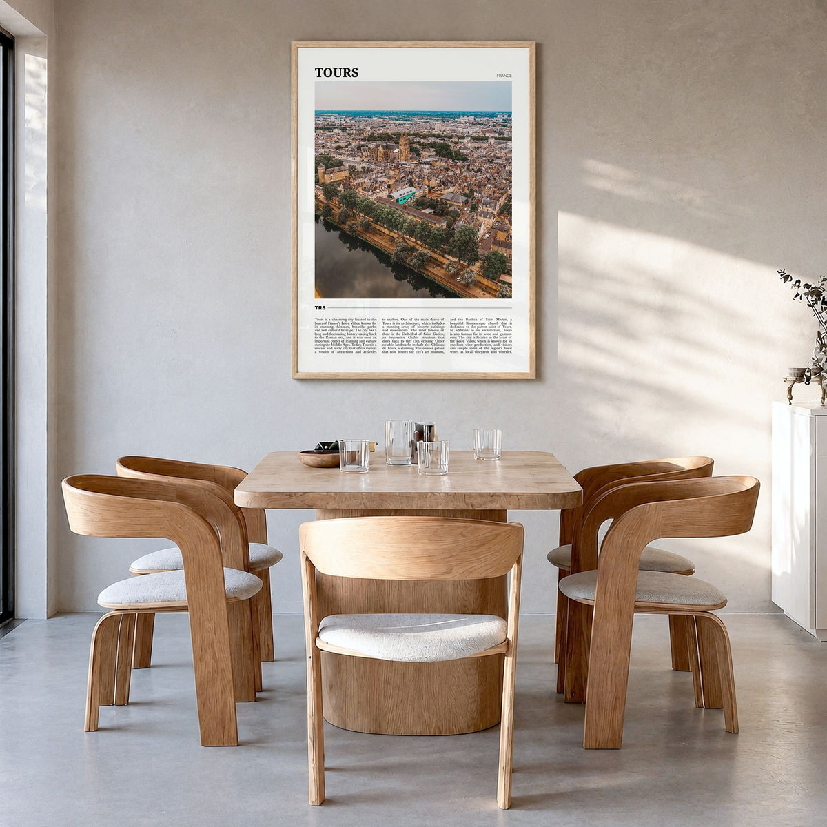 Tours Travel Poster in a natural wood frame, hanging in a dining room