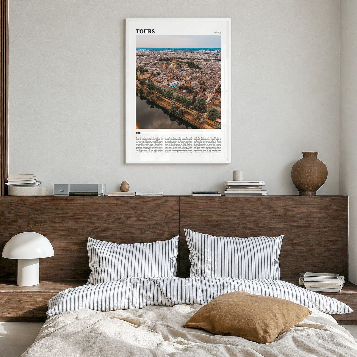 Tours Travel Poster in a white wood frame, hanging in a bedroom