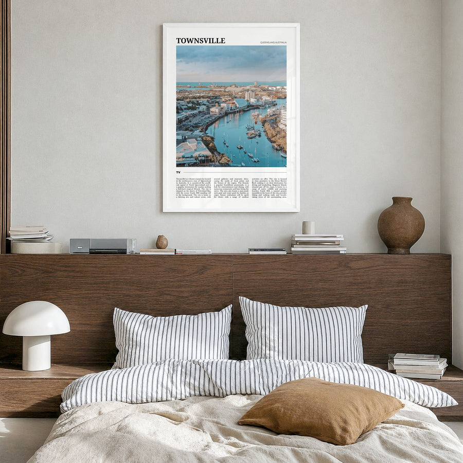 Townsville Travel Poster in a white wood frame, hanging in a bedroom