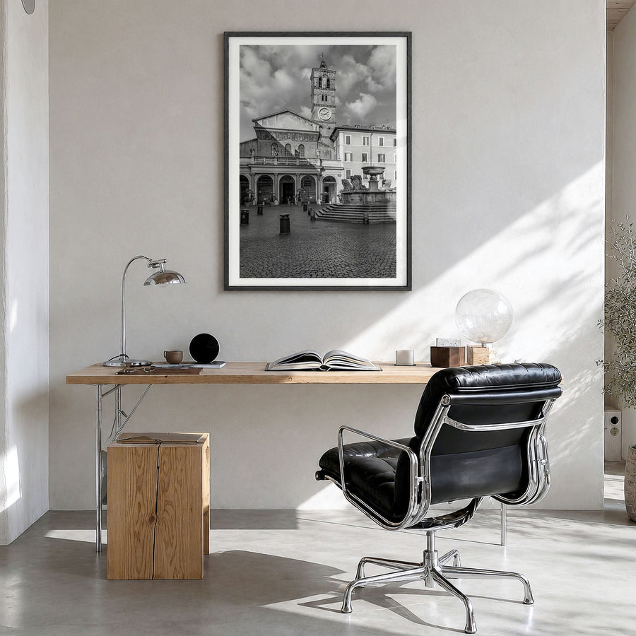 Trastevere Photo Poster in a black wood frame, hanging in a bright home office, white border
