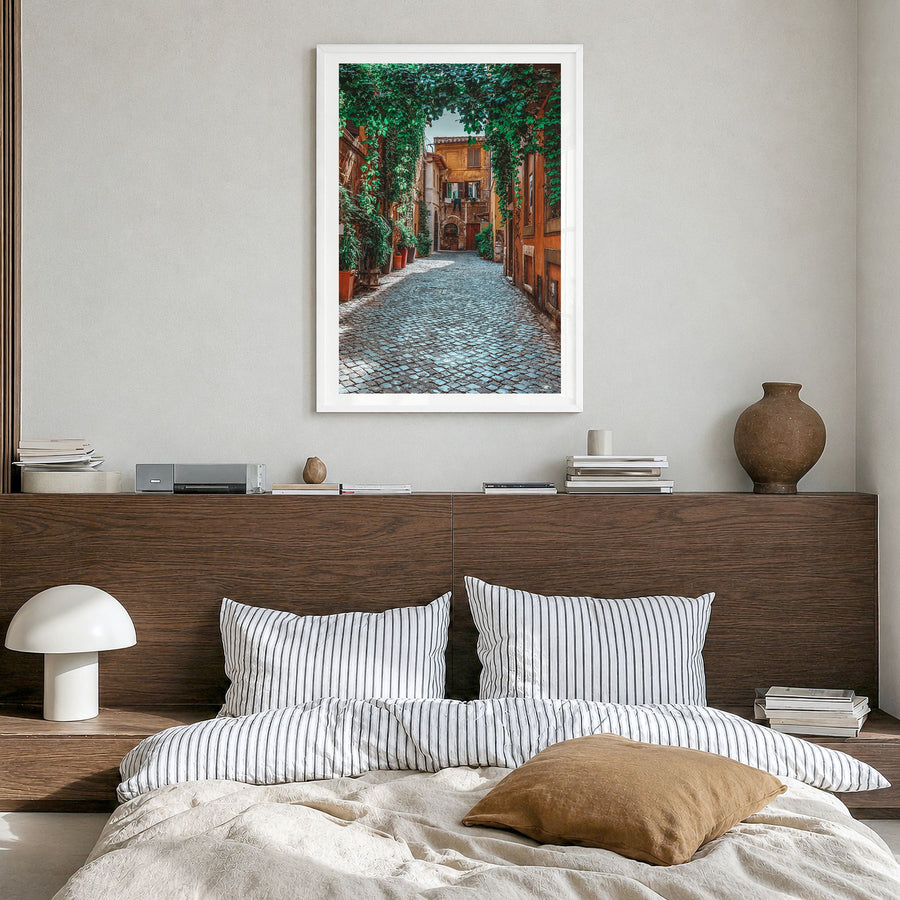 Trastevere Photo Poster in a white wood frame, hanging in a bedroom, white border