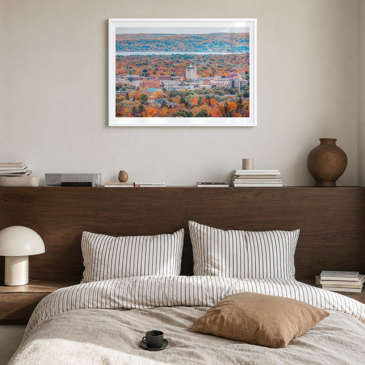 Traverse City Photo Poster in a white wood frame, hanging in a bedroom, white border