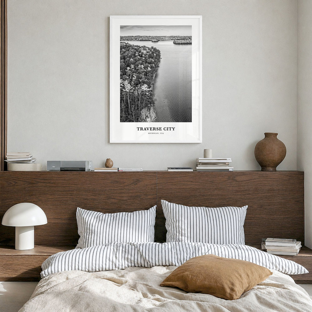 Traverse City Classic Poster in a white wood frame, hanging in a bedroom