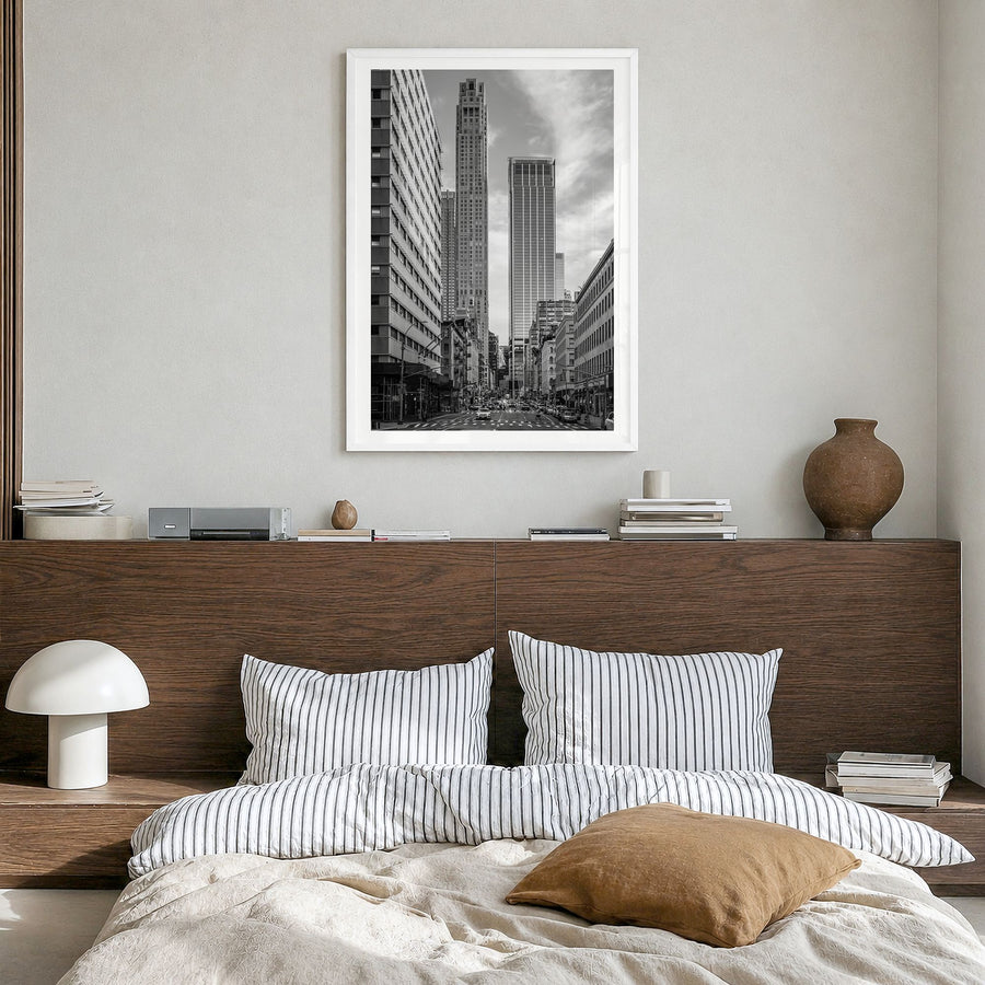 Tribeca Photo Poster in a white wood frame, hanging in a bedroom, white border
