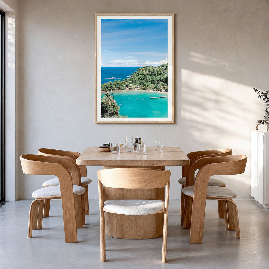 Trinidad and Tobago Photo Poster in a natural wood frame, hanging in a dining room, white border