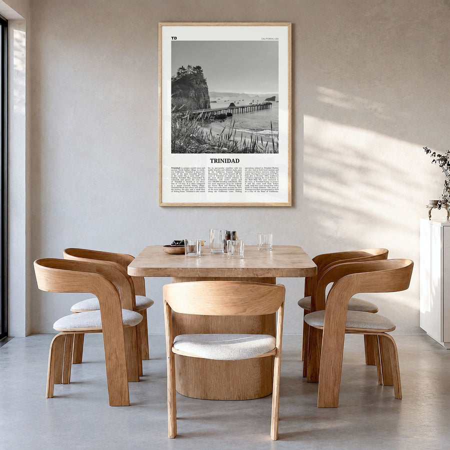 Trinidad, California Newspaper Poster in a natural wood frame, hanging in a dining room