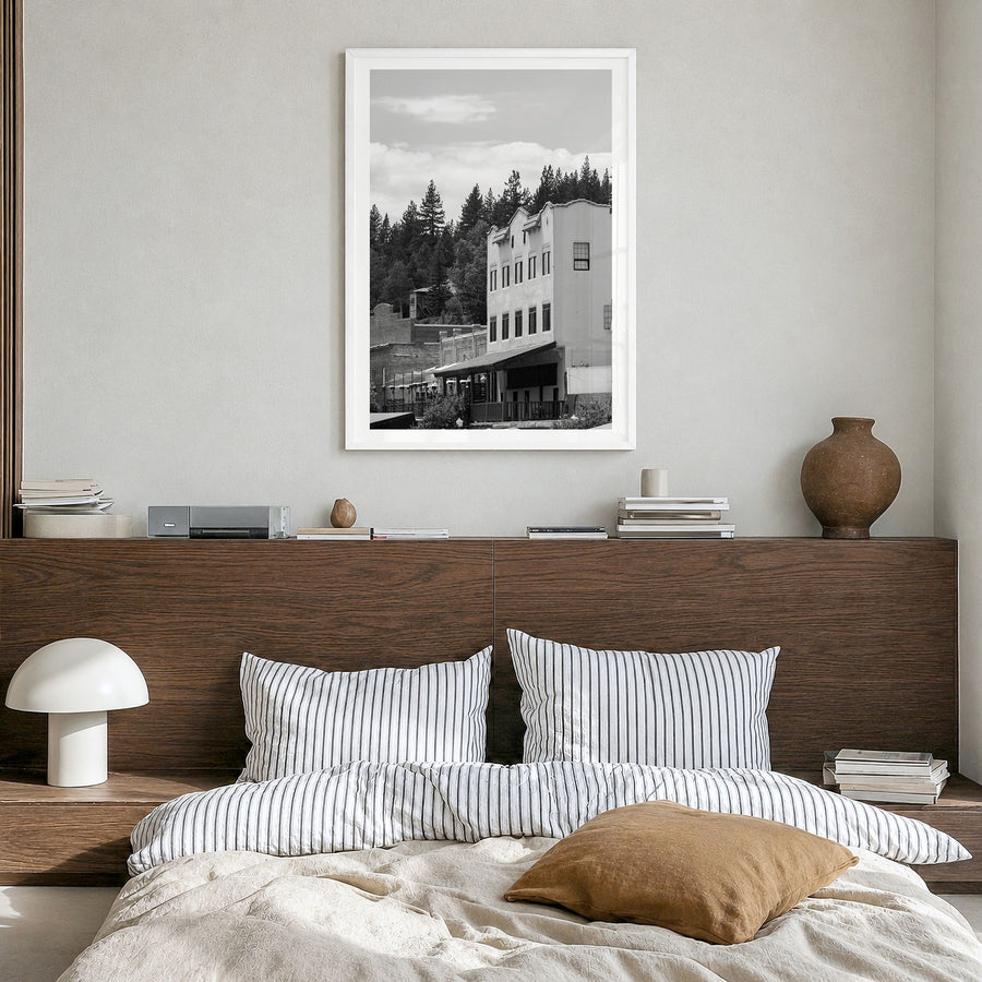 Truckee Photo Poster in a white wood frame, hanging in a bedroom, white border