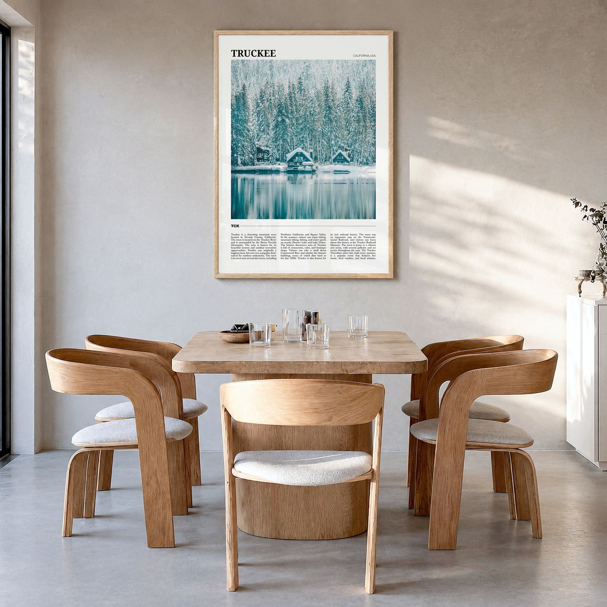 Truckee Travel Poster in a natural wood frame, hanging in a dining room